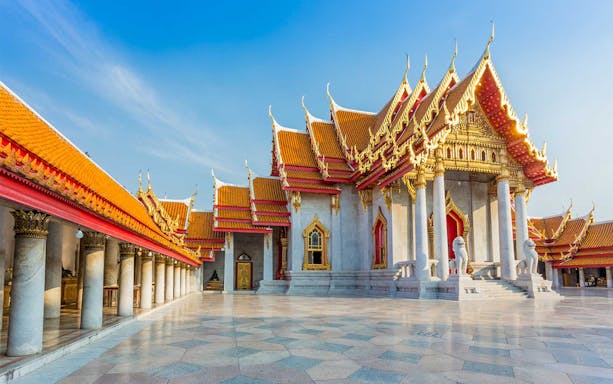 Marble Temple in Bangkok with ornate roof and columns, part of half-day tour.