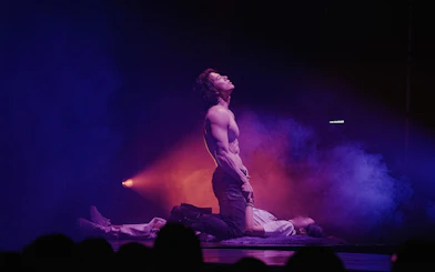 Performer on stage during Wild Wild Show in Korea with dramatic lighting.