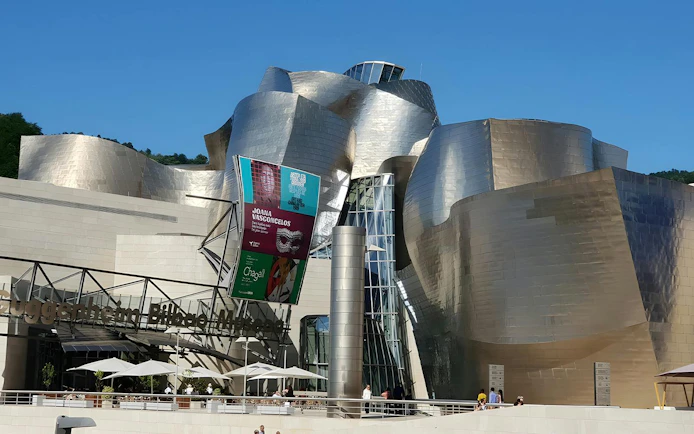 Exterior of Guggenheim Museum Bilbao, showcasing Frank Gehry's unique architectural design.
