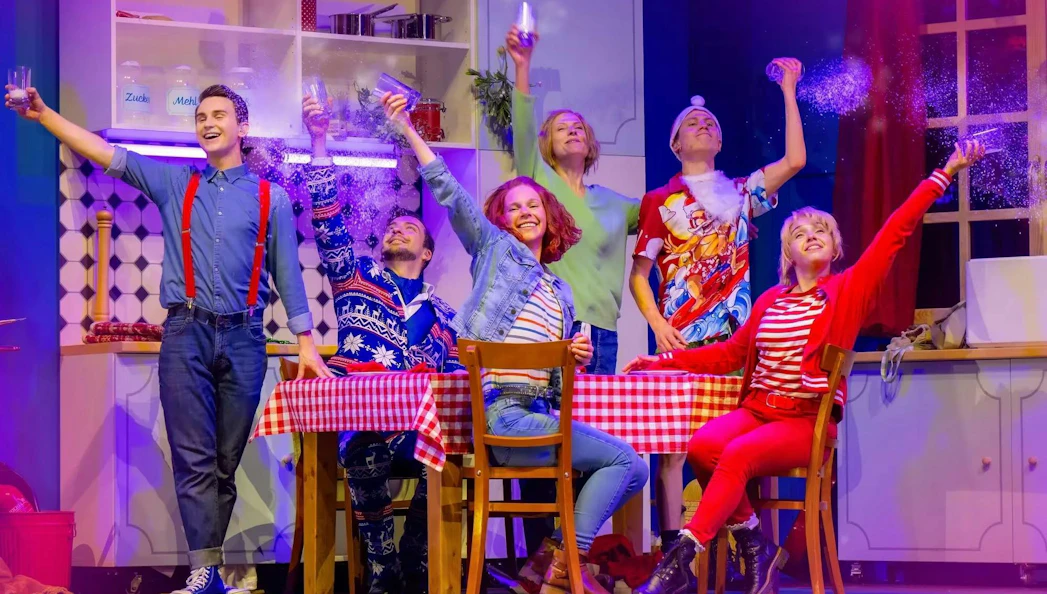 Performers celebrating in Bibi & Tina musical scene, Berlin.