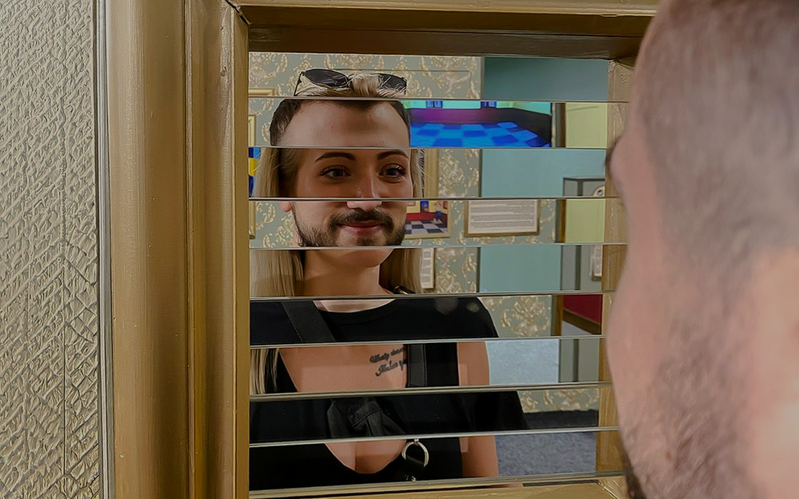 Person viewing optical illusion mirror at Museum of Fantastic Illusions.