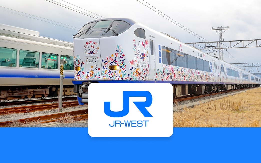 JR Haruka Airport Express train with Hello Kitty design on tracks.