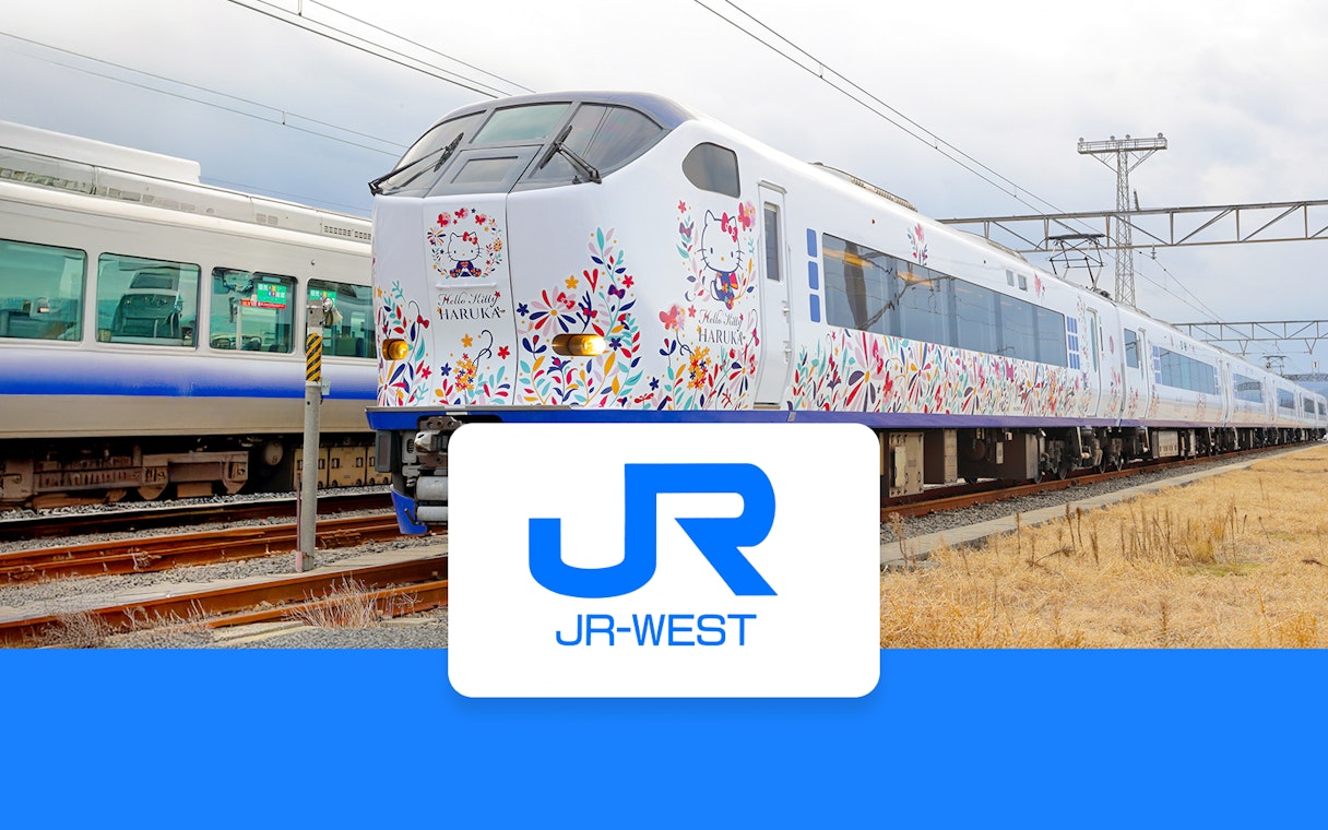 JR Haruka Airport Express train with Hello Kitty design on tracks.