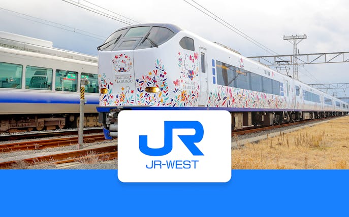 JR Haruka Airport Express train with Hello Kitty design on tracks.