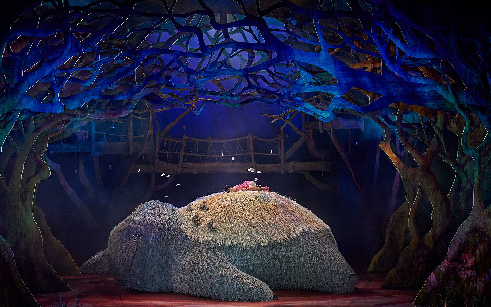 Stage scene from My Neighbour Totoro show in West End with Totoro and child.