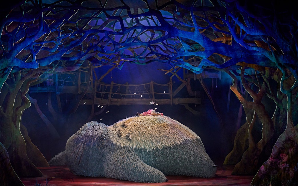 Stage scene from My Neighbour Totoro show in West End with Totoro and child.