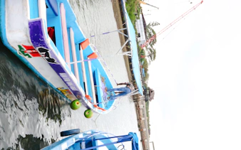 Boat docked at Wasini Island for Marine Park and Dolphin Watch tour, Diani Beach.