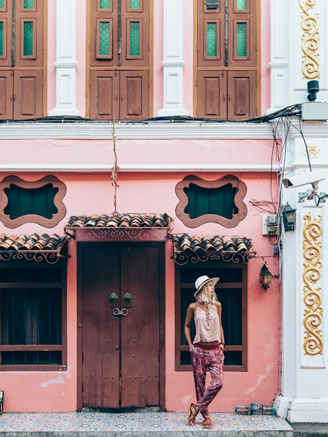 Colorful Sino-Portuguese building in Phuket Old Town during a guided tour.