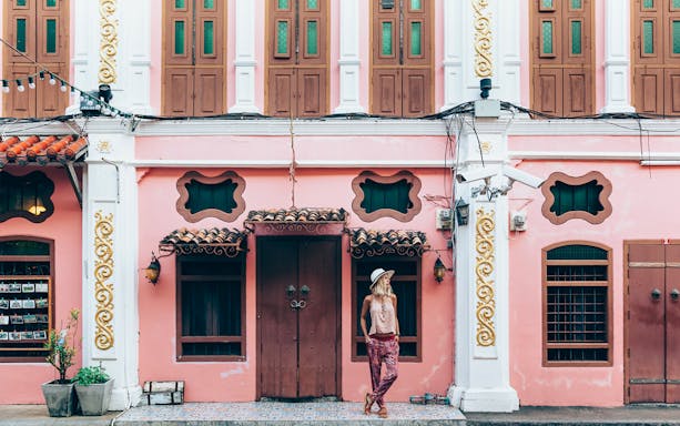 Colorful Sino-Portuguese building in Phuket Old Town during a guided tour.