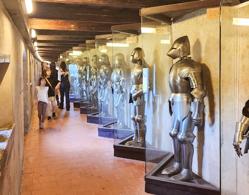 Prague Castle Powder Tower with tourists exploring the historic architecture.