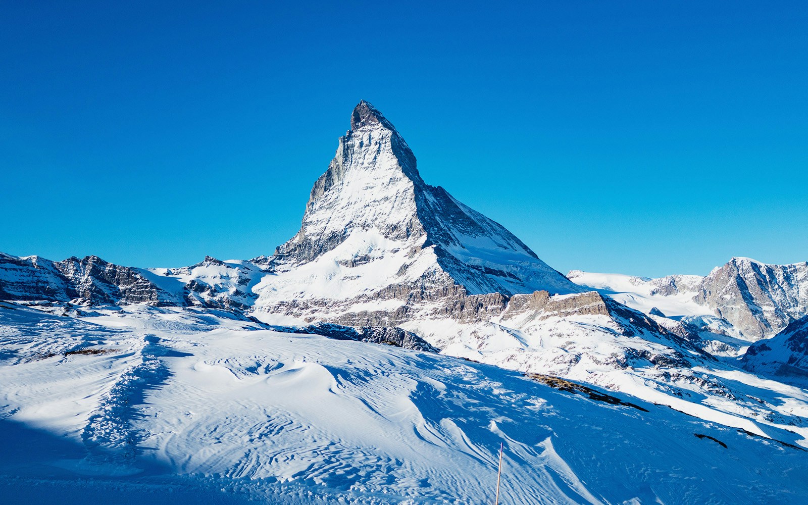 Matterhorn Glacier Paradise with snow-covered peaks and cable car in April, Zermatt, Switzerland.
