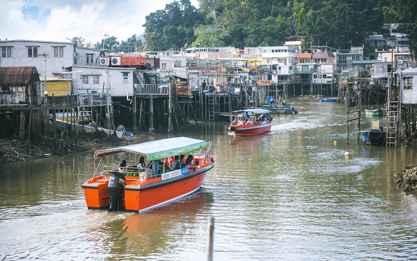 Boats navigating the waterways of Tai O Fishing Village on Lantau Island.