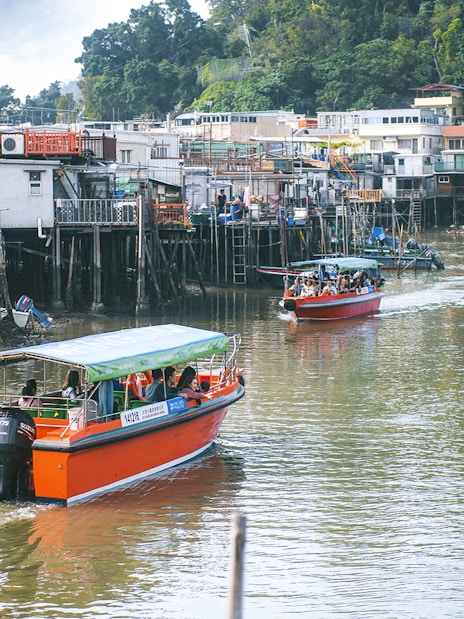 Boats navigating the waterways of Tai O Fishing Village on Lantau Island.