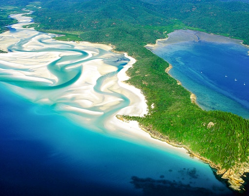 Aerial view of swirling white sands and turquoise waters at Tongue Bay, Whitsunday.