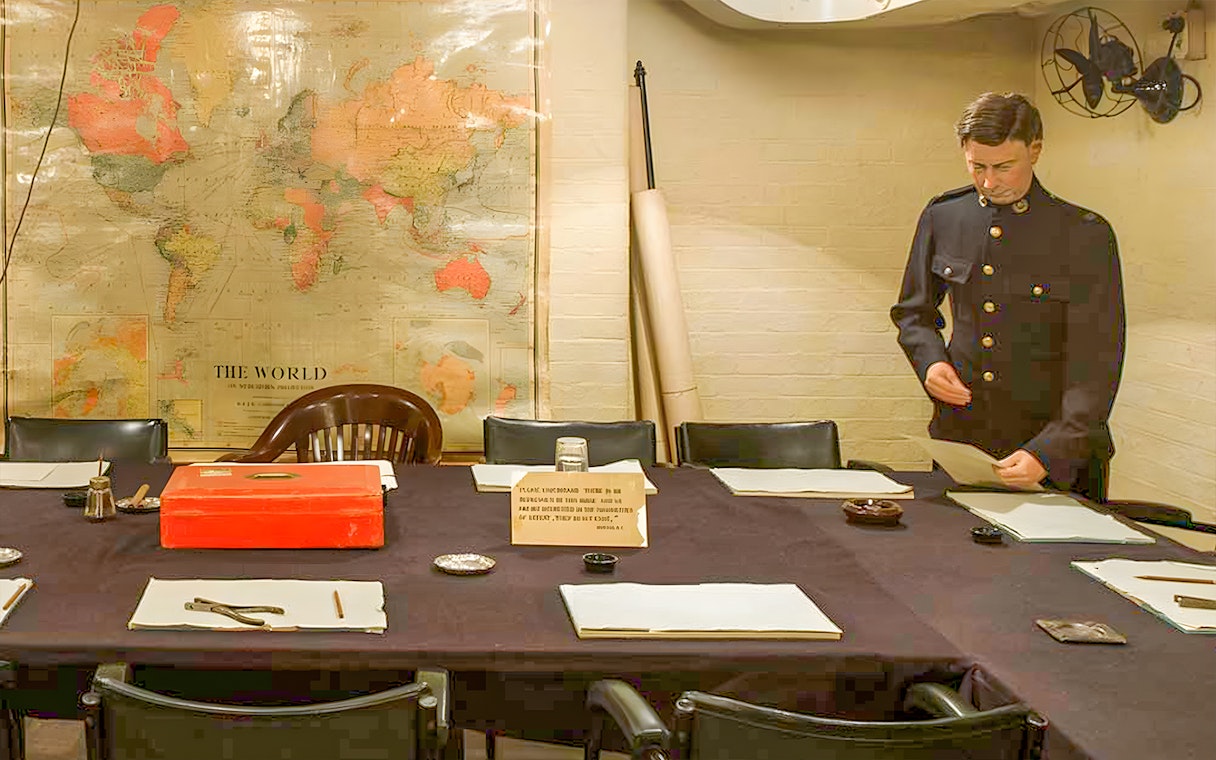Churchill War Rooms with map and officer during tour with audioguide.