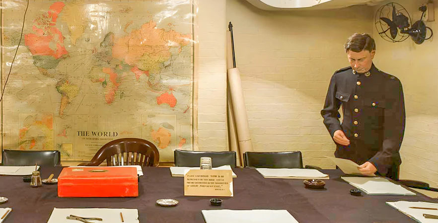 Churchill War Rooms with map and officer during tour with audioguide.
