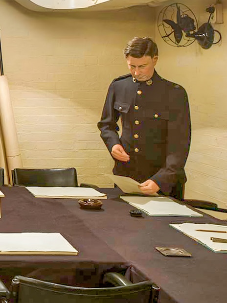Churchill War Rooms with map and officer during tour with audioguide.