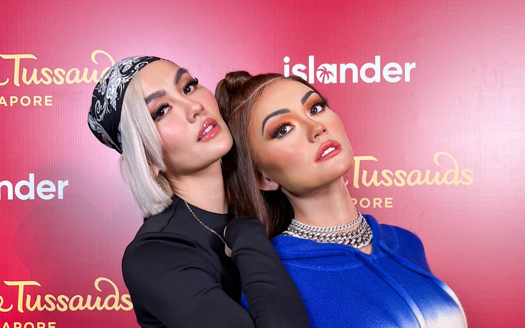 Wax figures at Madame Tussauds Singapore exhibit.