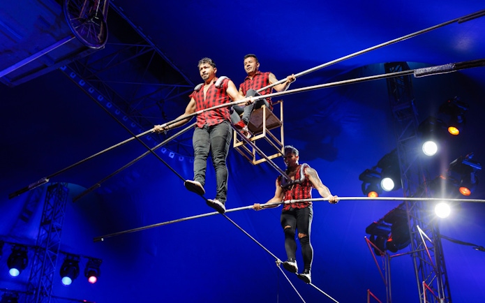 Acrobats performing on high wire at Aqua Circus Phuket.