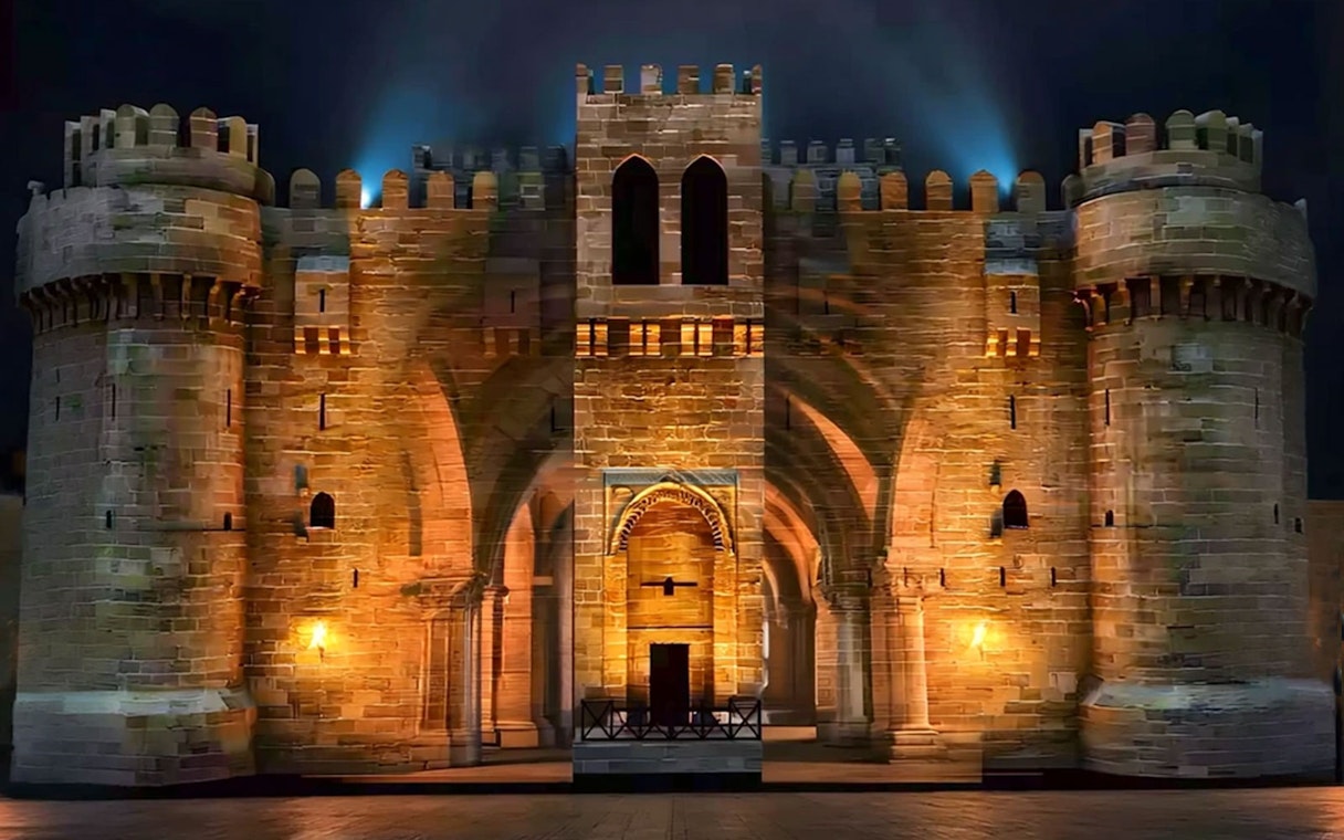 Qaitbay Citadel illuminated at night in Alexandria, Egypt.