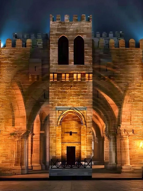 Qaitbay Citadel illuminated at night in Alexandria, Egypt.