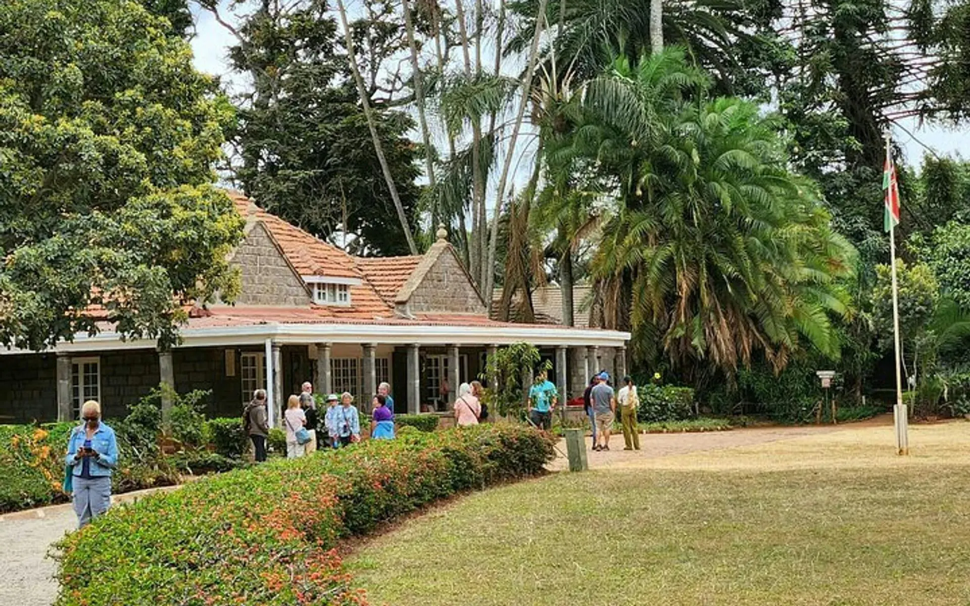 Visitors at Karen Blixen Museum, Nairobi, exploring the historic farmhouse and gardens.