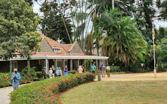 Visitors at Karen Blixen Museum, Nairobi, exploring the historic farmhouse and gardens.