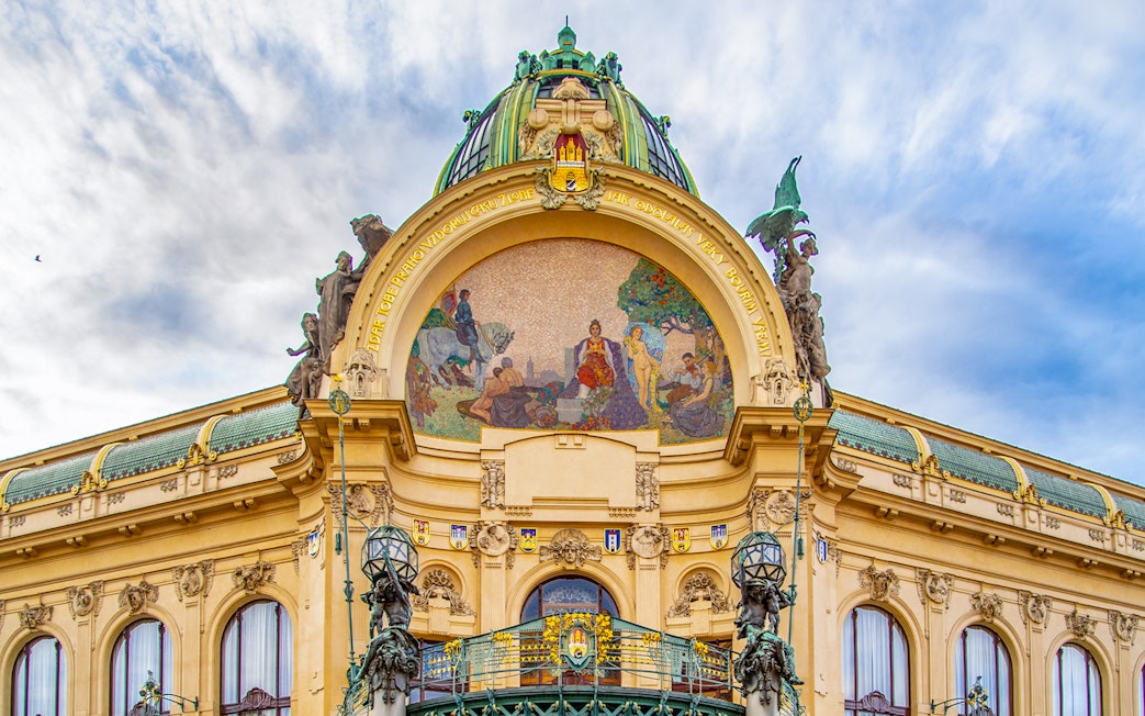 Municipal House facade with mosaic in Prague's Old Town.