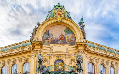 Municipal House facade with mosaic in Prague's Old Town.