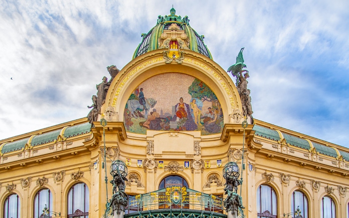 Municipal House facade with mosaic in Prague's Old Town.