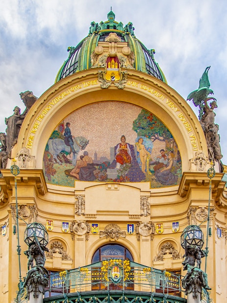 Municipal House facade with mosaic in Prague's Old Town.