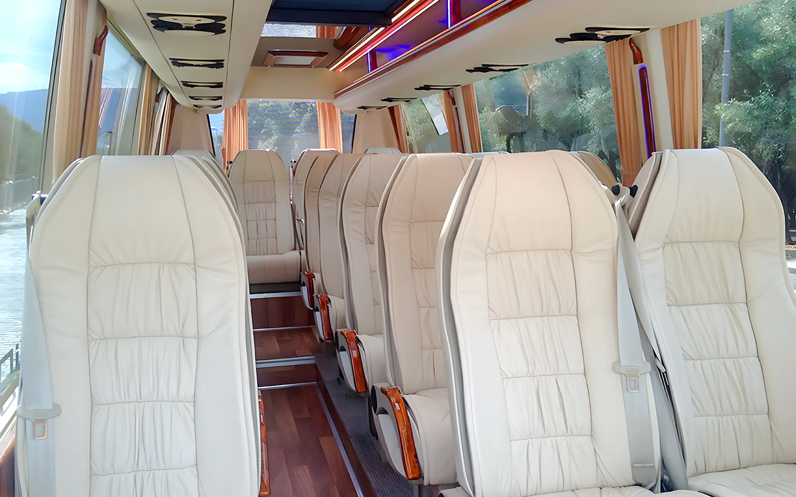 Minibus interior with comfortable seating for Meteora tour transport.