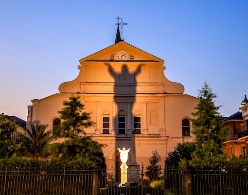 St. Louis Cathedral facade with shadow of Jesus statue, French Quarter, New Orleans.