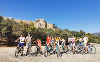 Group biking near the Acropolis in Athens on a guided tour.