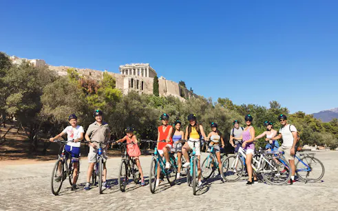 Group biking near the Acropolis in Athens on a guided tour.