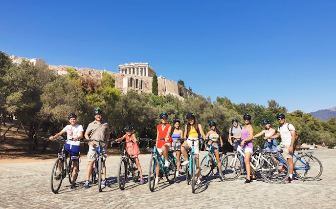 Group biking near the Acropolis in Athens on a guided tour.