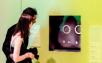 Visitors viewing Cartier jewelry display at NGV Friday Nights, National Gallery Victoria.