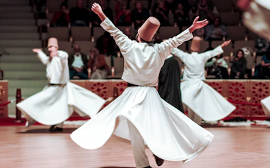 Whirling Dervishes performing in a cultural ceremony.