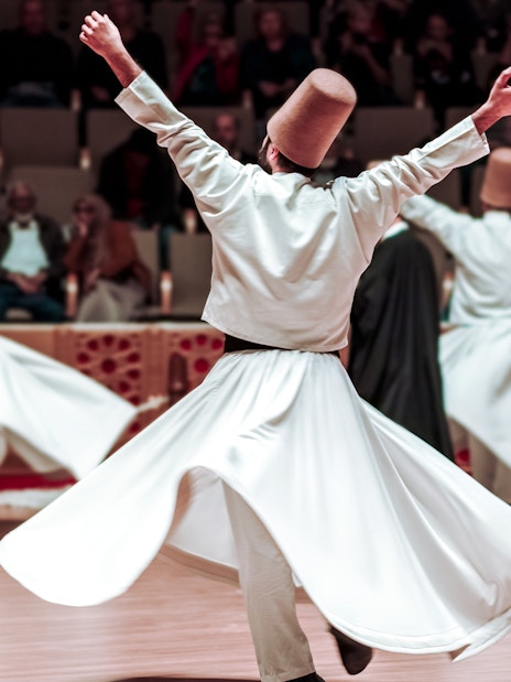 Whirling Dervishes performing in a cultural ceremony.