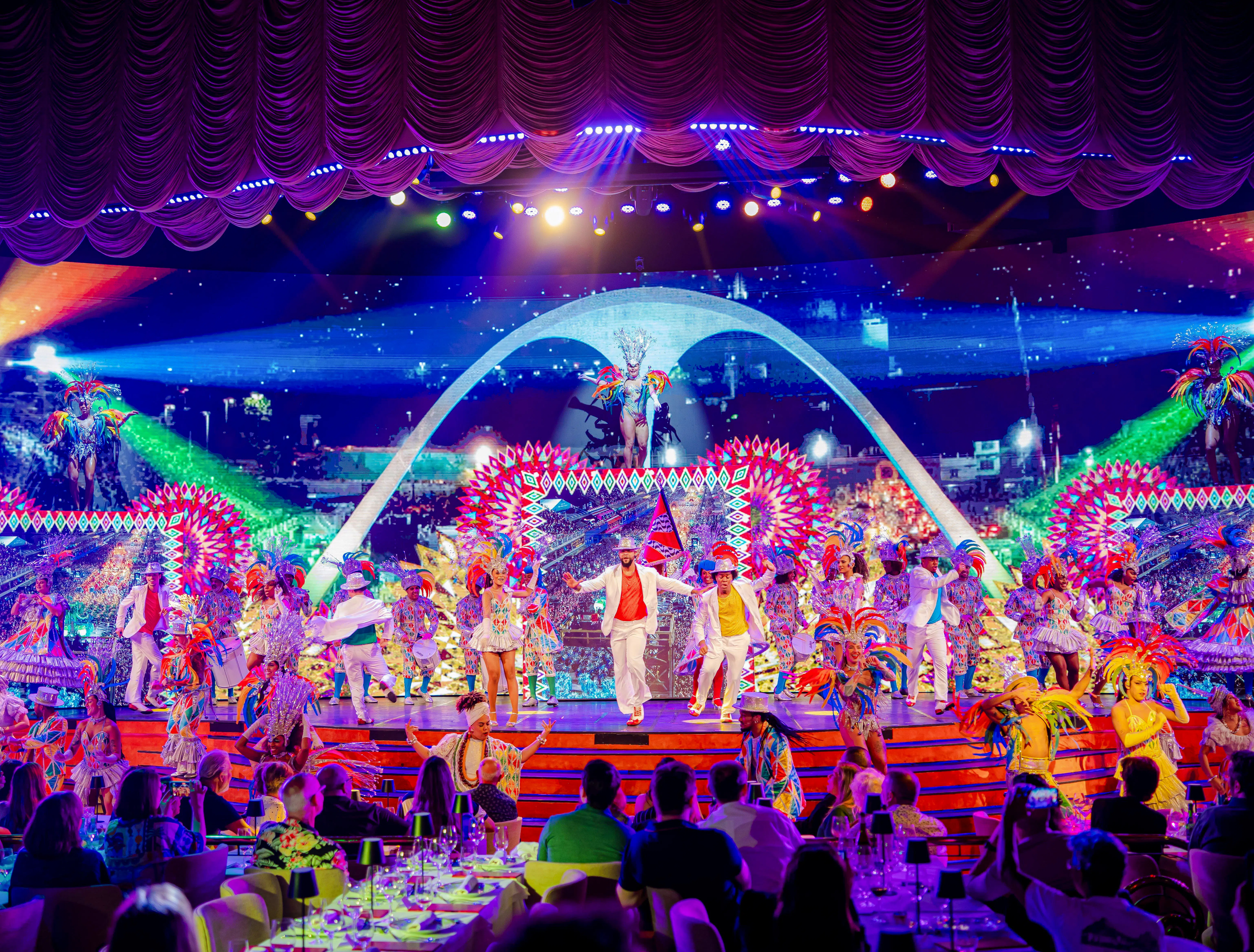 Performers in vibrant costumes on stage at Roxy Dinner Show, Rio de Janeiro.