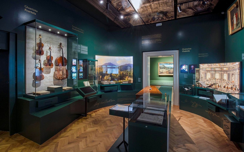 Exhibition room with musical instruments and paintings at Lobkowicz Palace Museum, Prague Castle.