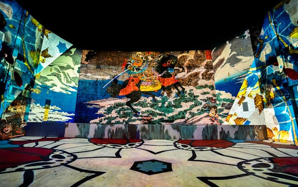 Immersive art projections at Other World Gallery, REXKL, featuring vibrant murals and patterns.