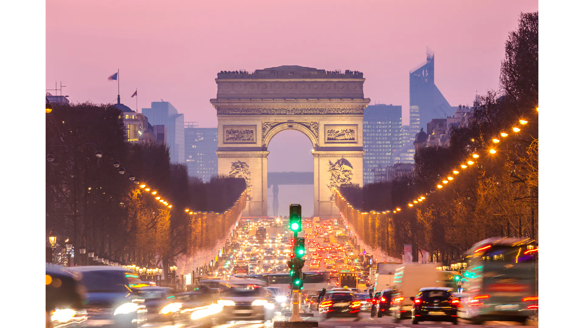 Arc de Triomphe view from Champs-Élysées during evening, Paris.