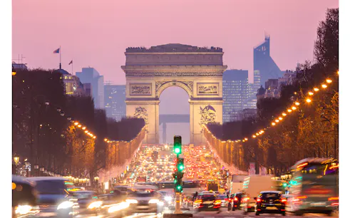 Arc de Triomphe view from Champs-Élysées during evening, Paris.