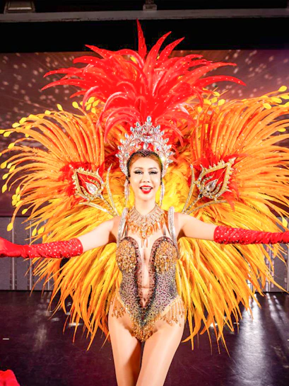 Phuket Simon Cabaret performers in vibrant costumes on stage.