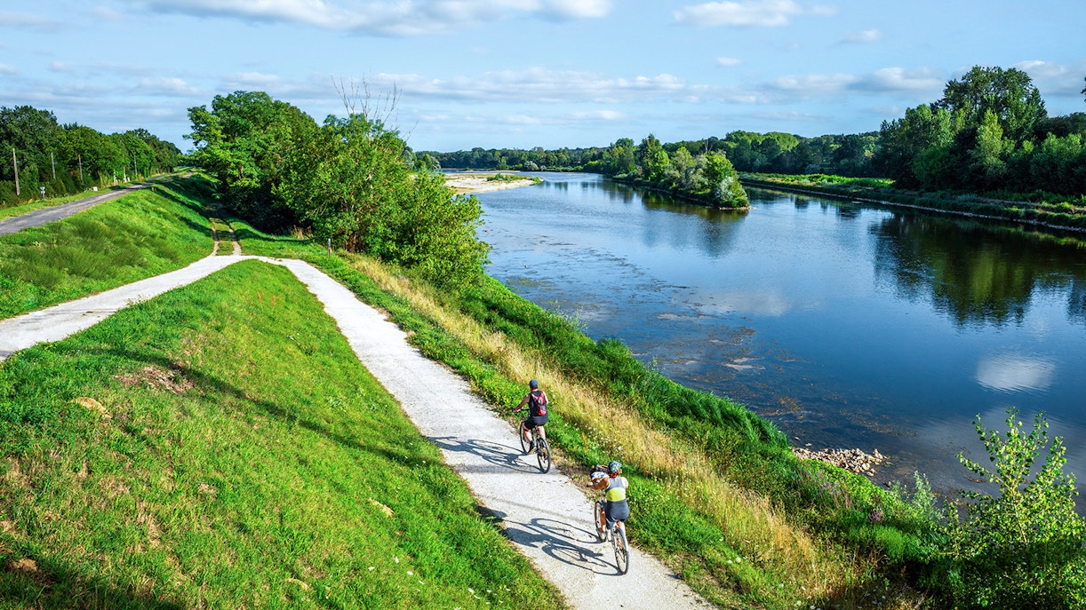 People on the bike by the river in Loire Valley