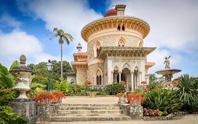 Monserrate Palace exterior with ornate architecture and lush gardens in Sintra, Portugal.