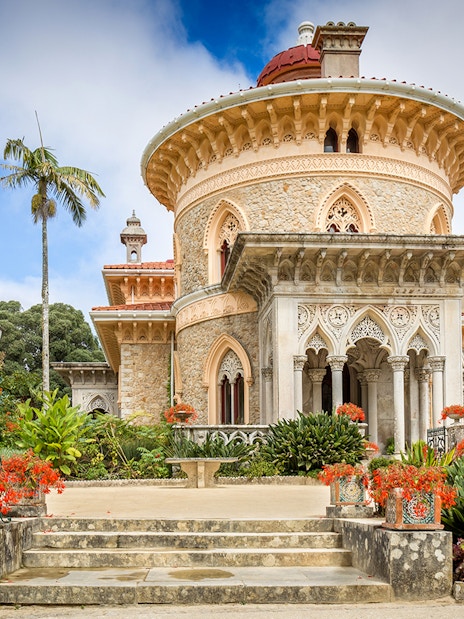 Monserrate Palace exterior with ornate architecture and lush gardens in Sintra, Portugal.