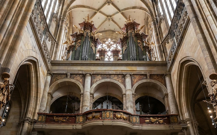 Organ pipes and ornate details inside St. Vitus Cathedral, Prague.