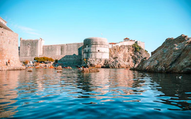 Dubrovnik city walls viewed from the sea during a boat tour.